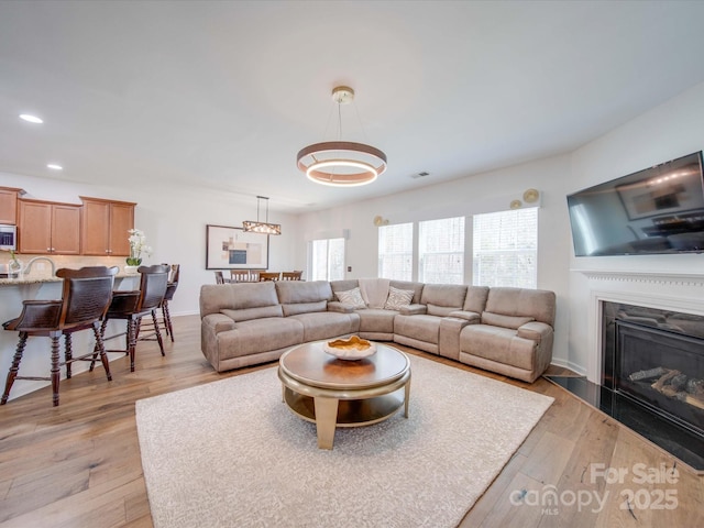 living room featuring light wood-type flooring