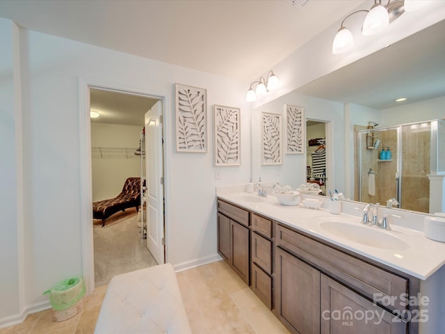 bathroom featuring walk in shower and vanity