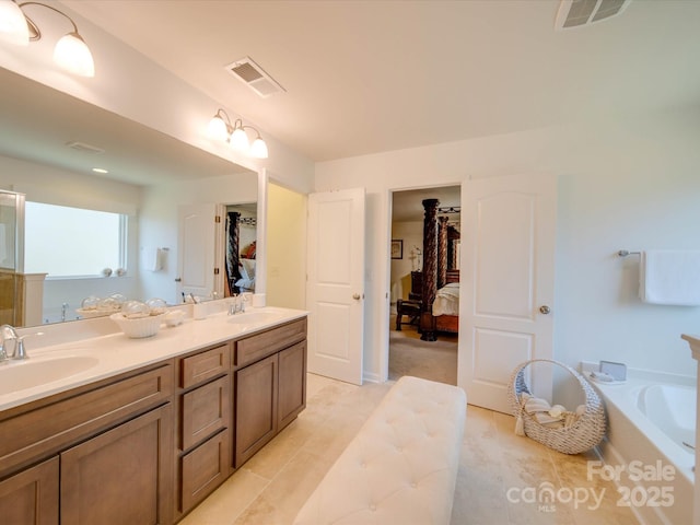 bathroom featuring vanity and a bathtub