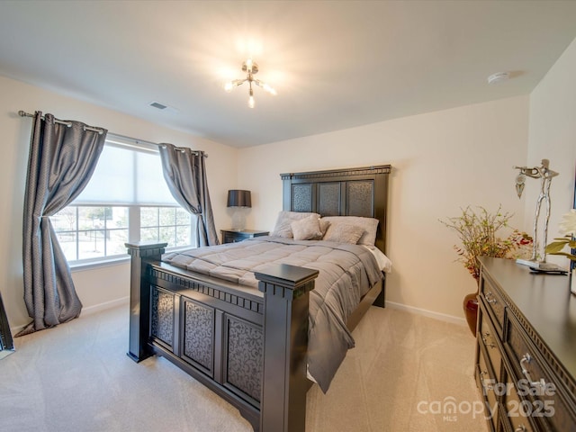 bedroom with light colored carpet