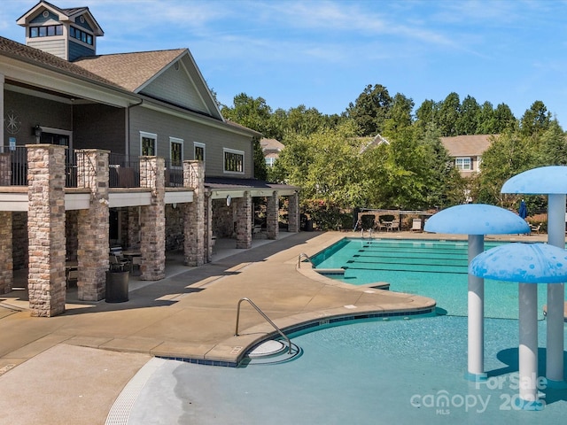 view of swimming pool with a patio