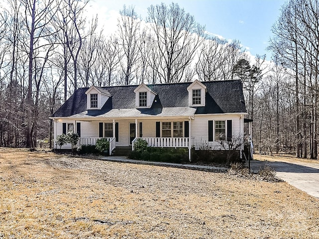 cape cod-style house featuring a porch