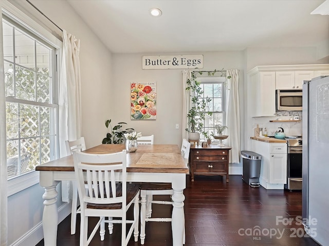 dining area featuring dark hardwood / wood-style floors