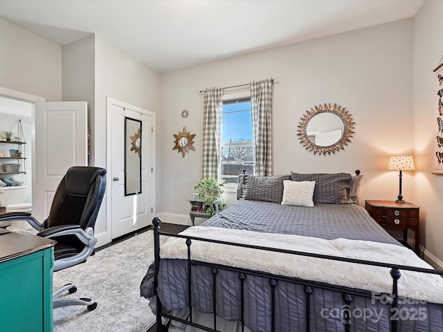 bedroom with hardwood / wood-style floors