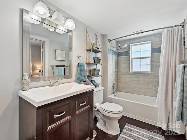 full bathroom featuring vanity, wood-type flooring, shower / tub combo, and toilet