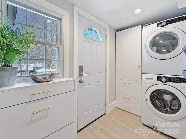 laundry room featuring stacked washer / dryer