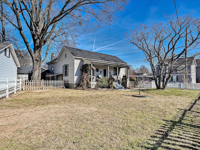 exterior space with a front yard and covered porch