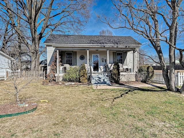 view of front of home with covered porch and a front yard