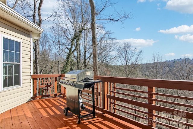 wooden deck with area for grilling