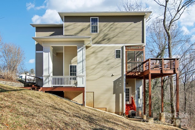 rear view of house with a lawn