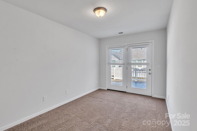 view of carpeted spare room