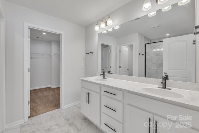 bathroom with vanity and a shower with shower door