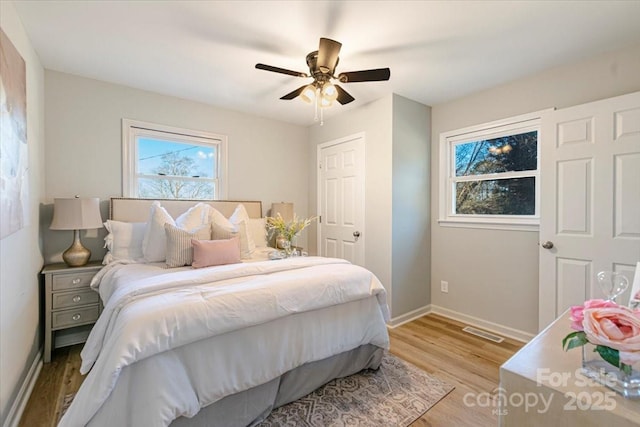 bedroom featuring ceiling fan and light wood-type flooring