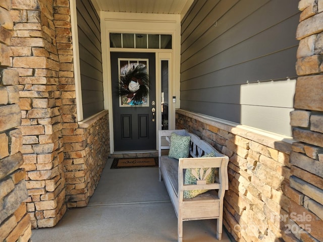 view of exterior entry with stone siding