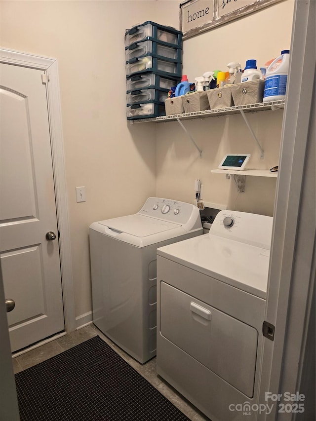 laundry area with laundry area and washing machine and clothes dryer