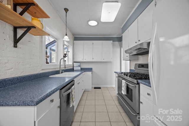 kitchen with light tile patterned flooring, pendant lighting, sink, white cabinets, and stainless steel appliances