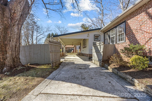 view of home's exterior featuring a carport