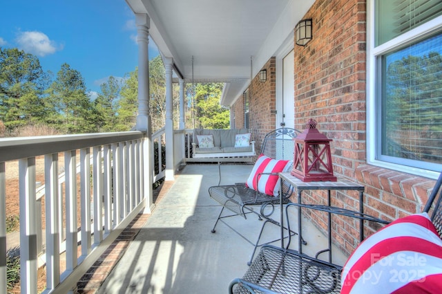 balcony featuring a porch