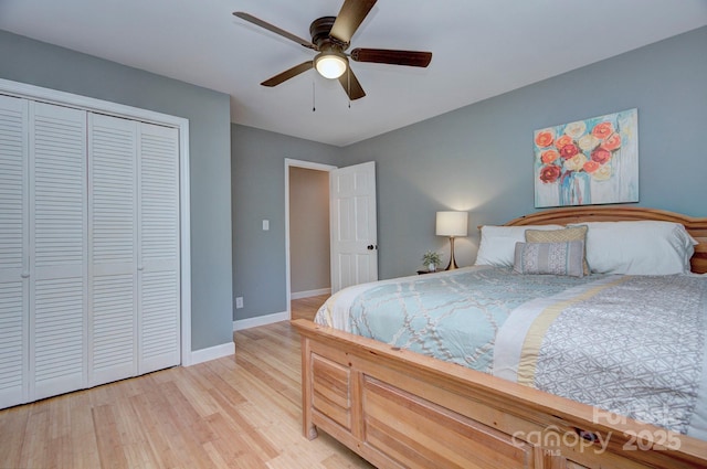 bedroom with a closet, ceiling fan, and light wood-type flooring