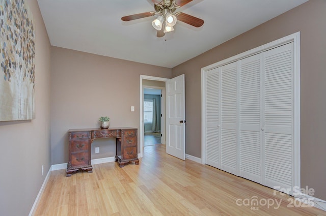 bedroom with a closet, ceiling fan, and light hardwood / wood-style flooring