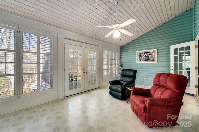 sitting room with vaulted ceiling, wood-type flooring, ceiling fan, wood ceiling, and french doors