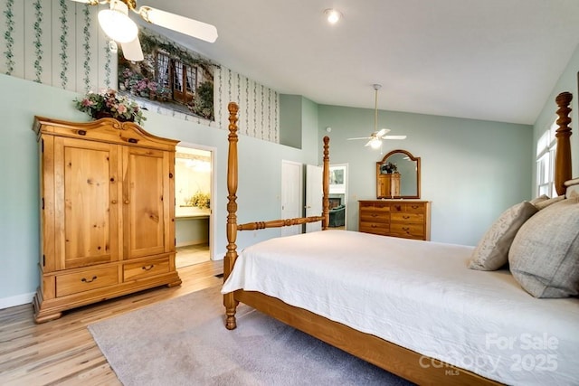 bedroom featuring vaulted ceiling, light hardwood / wood-style floors, and ceiling fan