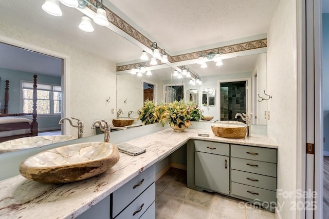 bathroom featuring tile patterned floors and vanity