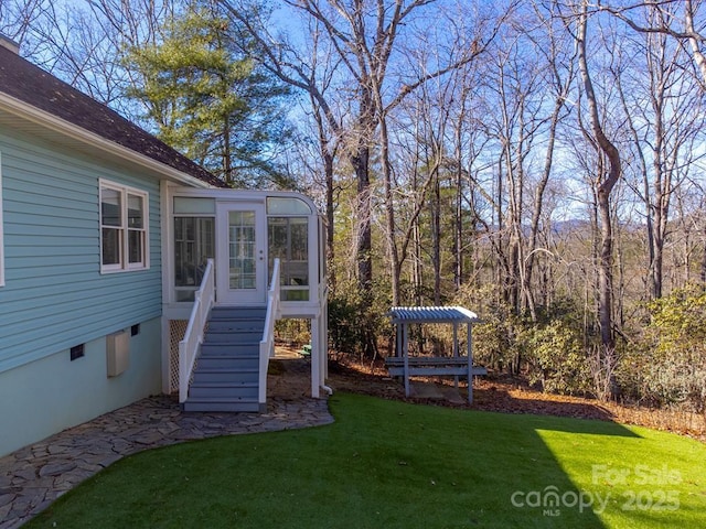 view of yard with a sunroom