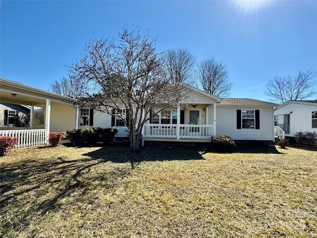 436 Riverwind Dr, Hendersonville, NC 28739 - ranch-style house featuring a front yard and covered porch