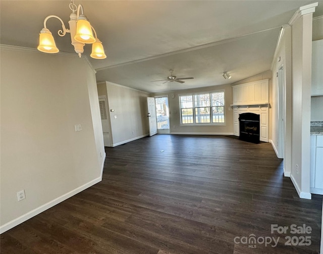 436 Riverwind Dr, Hendersonville, NC 28739 - unfurnished living room with dark hardwood / wood-style flooring, ceiling fan with notable chandelier, vaulted ceiling, and ornamental molding
