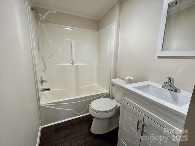 436 Riverwind Dr, Hendersonville, NC 28739 - full bathroom featuring wood-type flooring, ornamental molding, vanity, toilet, and tub / shower combination