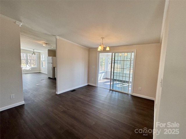 436 Riverwind Dr, Hendersonville, NC 28739 - unfurnished room with dark hardwood / wood-style flooring, a notable chandelier, and crown molding