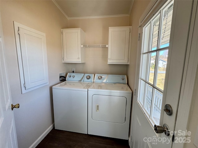 436 Riverwind Dr, Hendersonville, NC 28739 - laundry area with cabinets, ornamental molding, dark hardwood / wood-style floors, and washer and clothes dryer