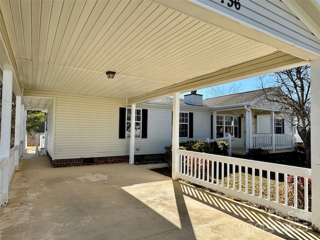 436 Riverwind Dr, Hendersonville, NC 28739 - view of patio with a carport and covered porch