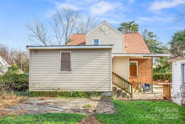 rear view of property with a patio