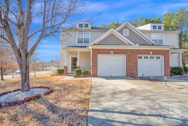 view of front of house with a porch and a garage