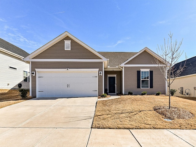 single story home featuring a garage