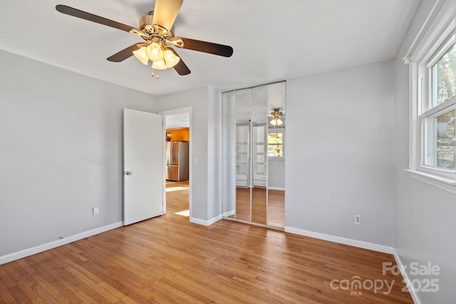 16 Rosscraggon Dr, Asheville, NC 28803 - unfurnished bedroom with stainless steel refrigerator, ceiling fan, and light hardwood / wood-style flooring
