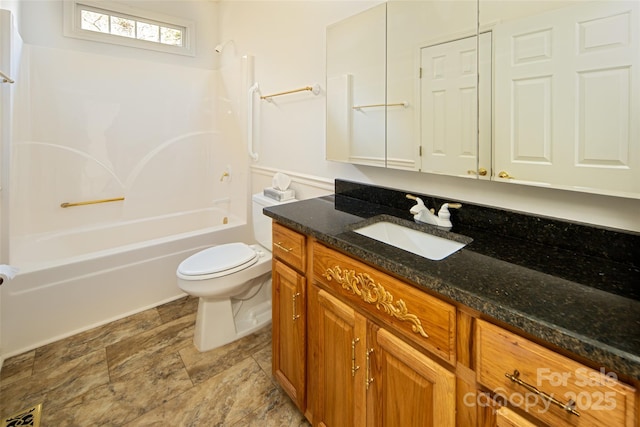 full bathroom with  shower combination, toilet, and vanity