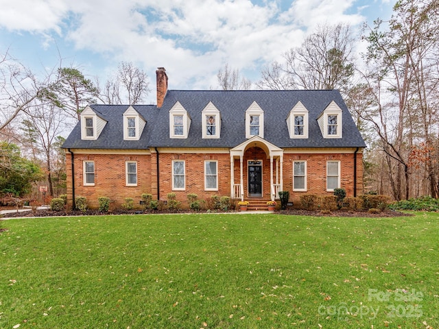 new england style home with a front lawn