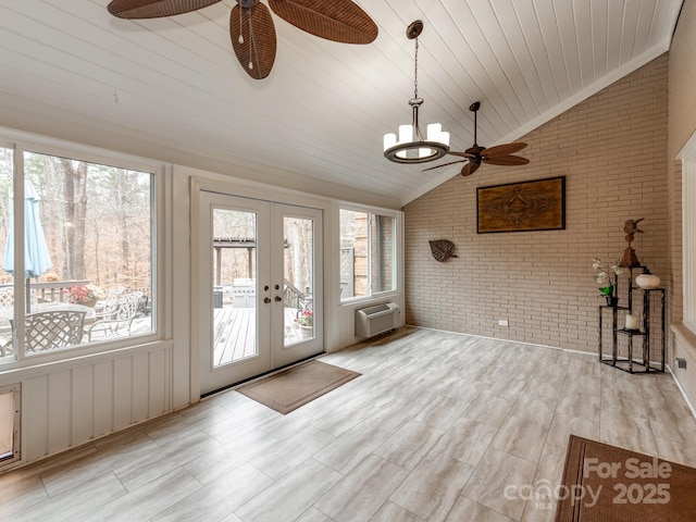 unfurnished sunroom featuring vaulted ceiling, a wall mounted AC, wooden ceiling, an inviting chandelier, and french doors