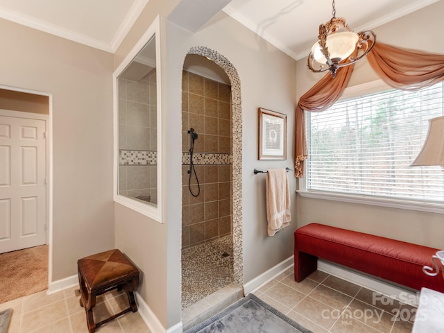 bathroom with tile patterned flooring, a notable chandelier, crown molding, and tiled shower