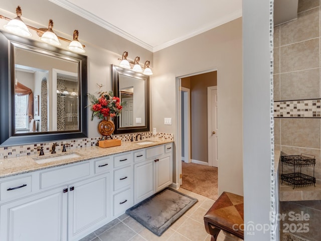 bathroom with tasteful backsplash, ornamental molding, tile patterned flooring, and vanity