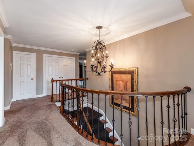 stairway featuring crown molding, carpet floors, and a notable chandelier