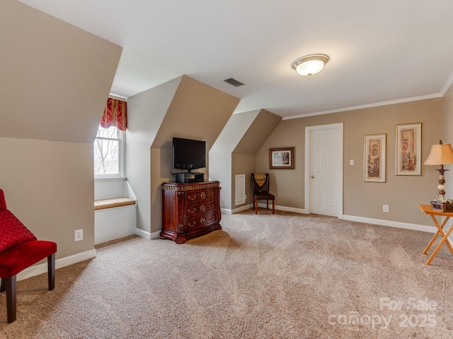 sitting room with ornamental molding, vaulted ceiling, and light carpet