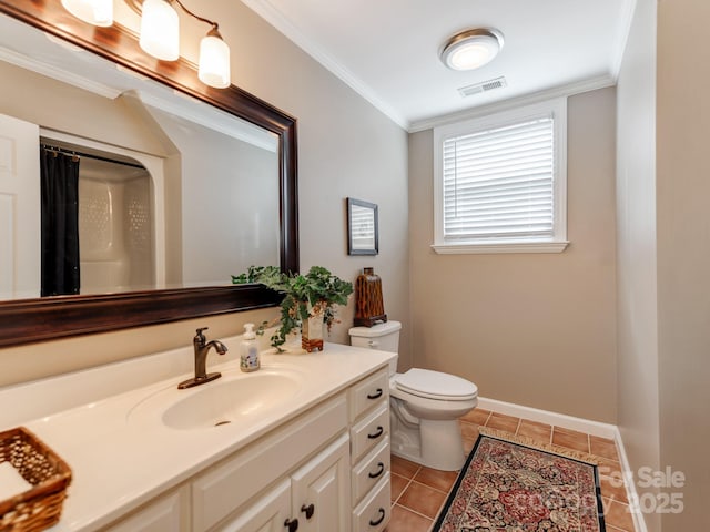 bathroom with ornamental molding, vanity, tile patterned floors, and toilet