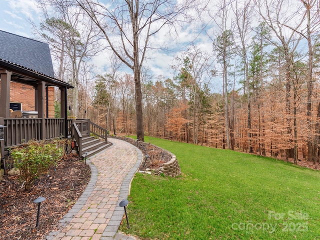 view of yard featuring a wooden deck