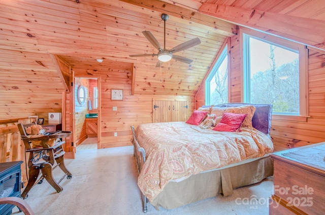 carpeted bedroom featuring lofted ceiling, wood ceiling, and wood walls