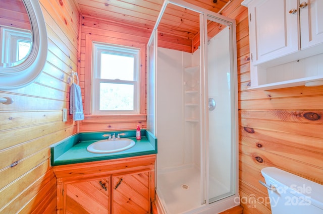 bathroom with wooden walls, an enclosed shower, vanity, wooden ceiling, and toilet