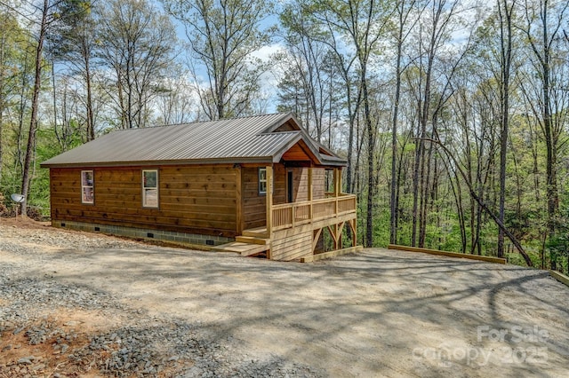 exterior space featuring a wooden deck